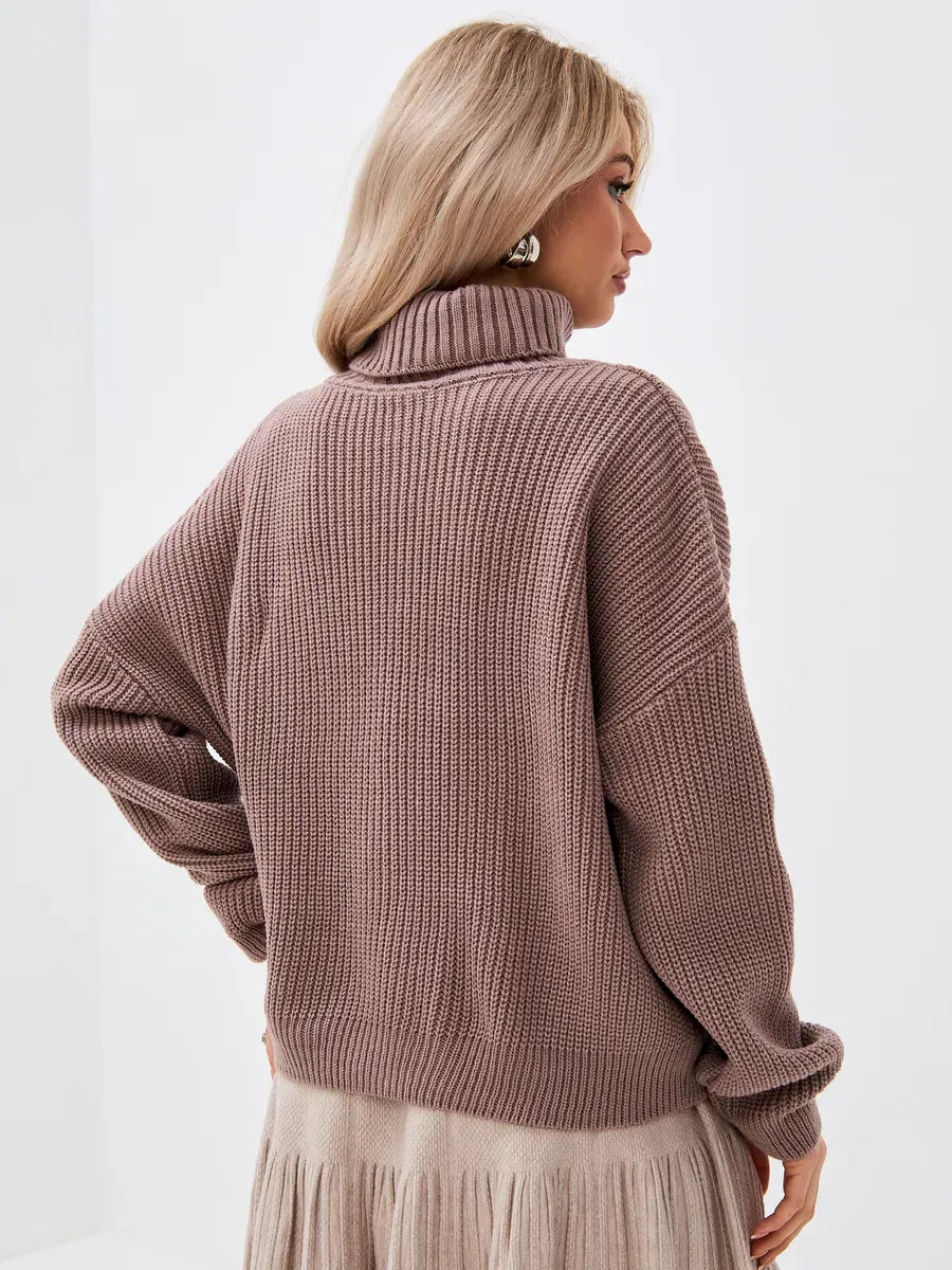 Woman wearing the Florence Sweater in coffee tone, showcasing the oversized knit and turtleneck style by Lauven.