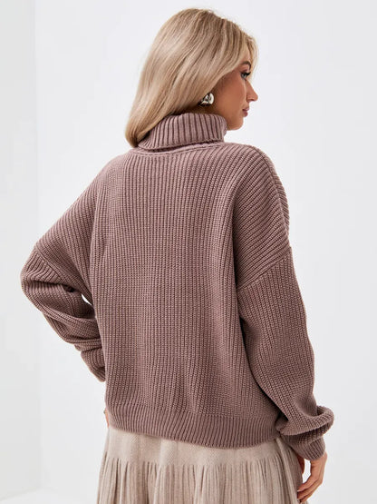 Woman wearing the Florence Sweater in coffee tone, showcasing the oversized knit and turtleneck style by Lauven.