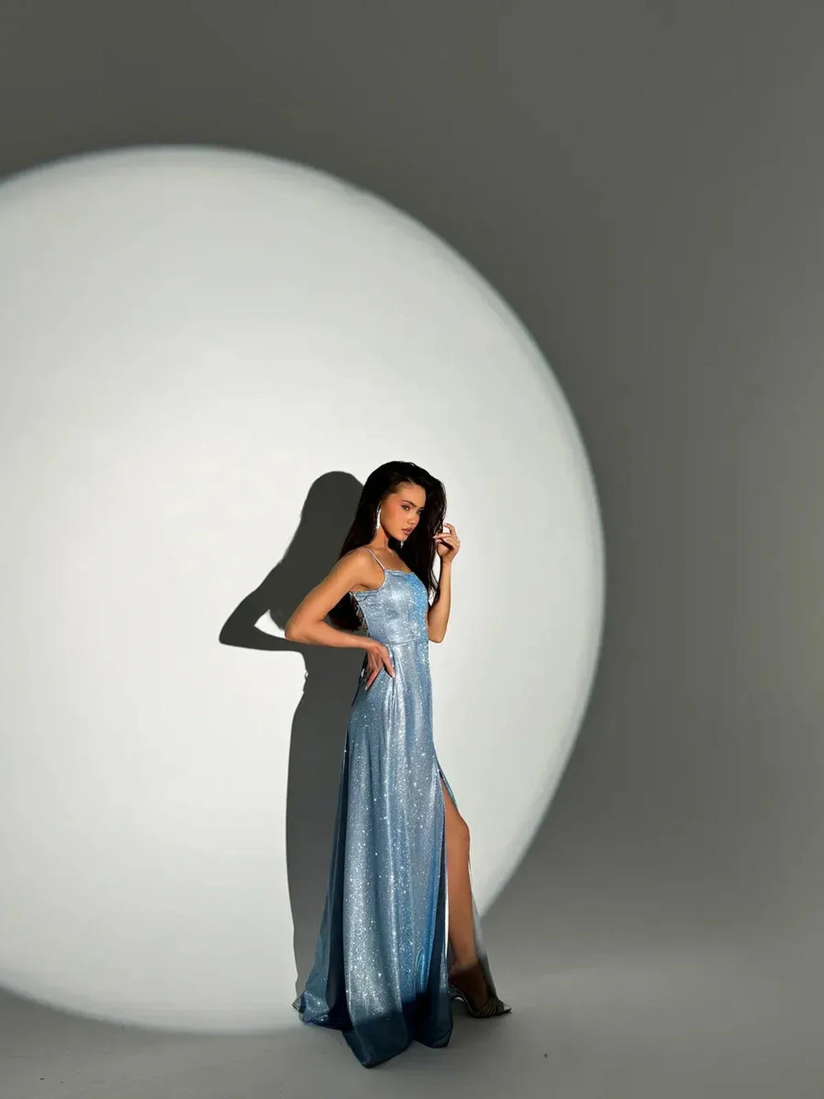 Glow Maxi Dress by Lauven - Light blue glitter evening gown showcasing a fitted silhouette and elegant design.