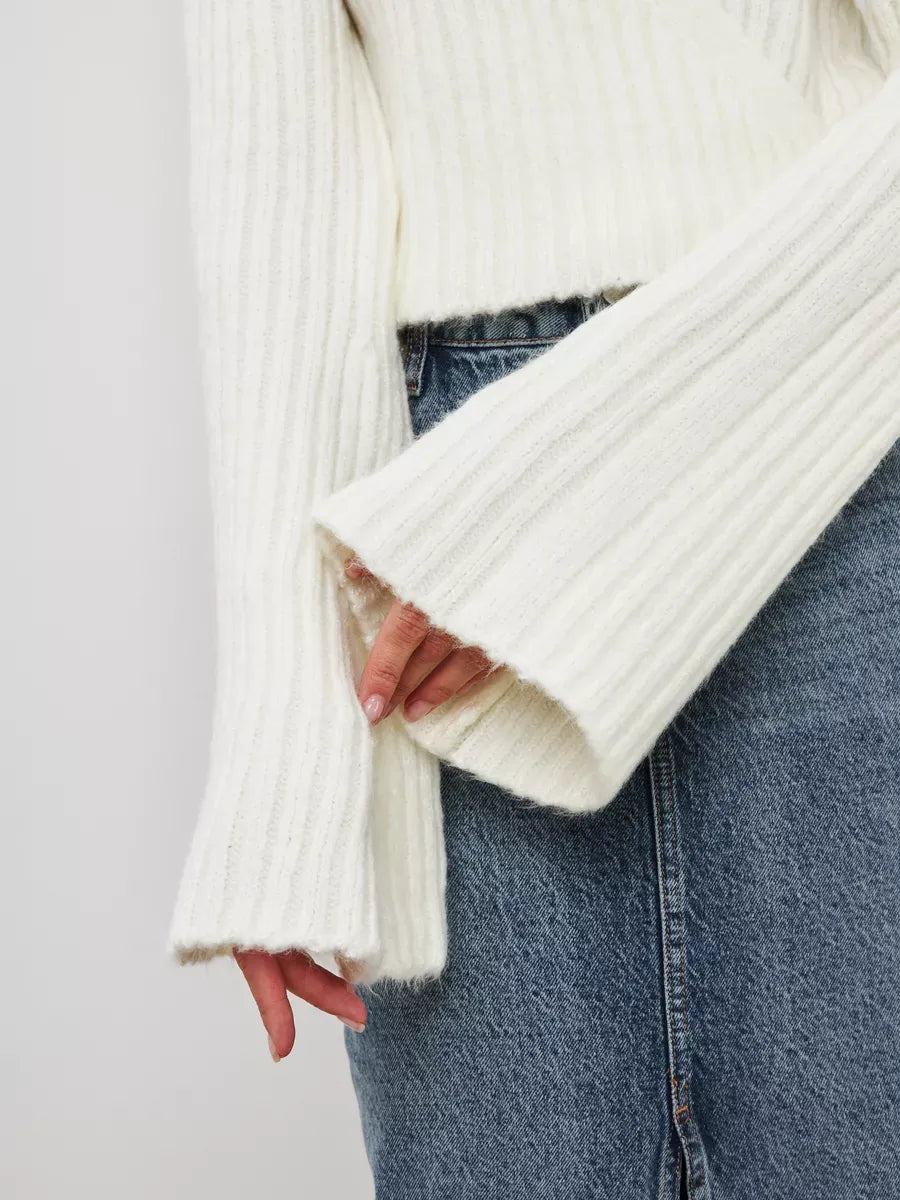 Lyra Sweater by Lauven featuring a cropped cream knit design with ribbed texture and wide sleeves.