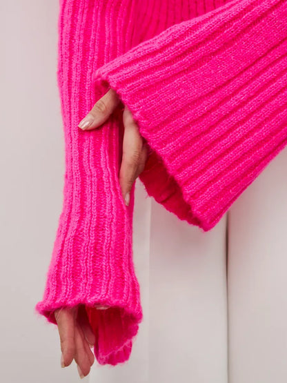 Selene Sweater by Lauven featuring a vibrant fuchsia cropped knit with wide cuffs.