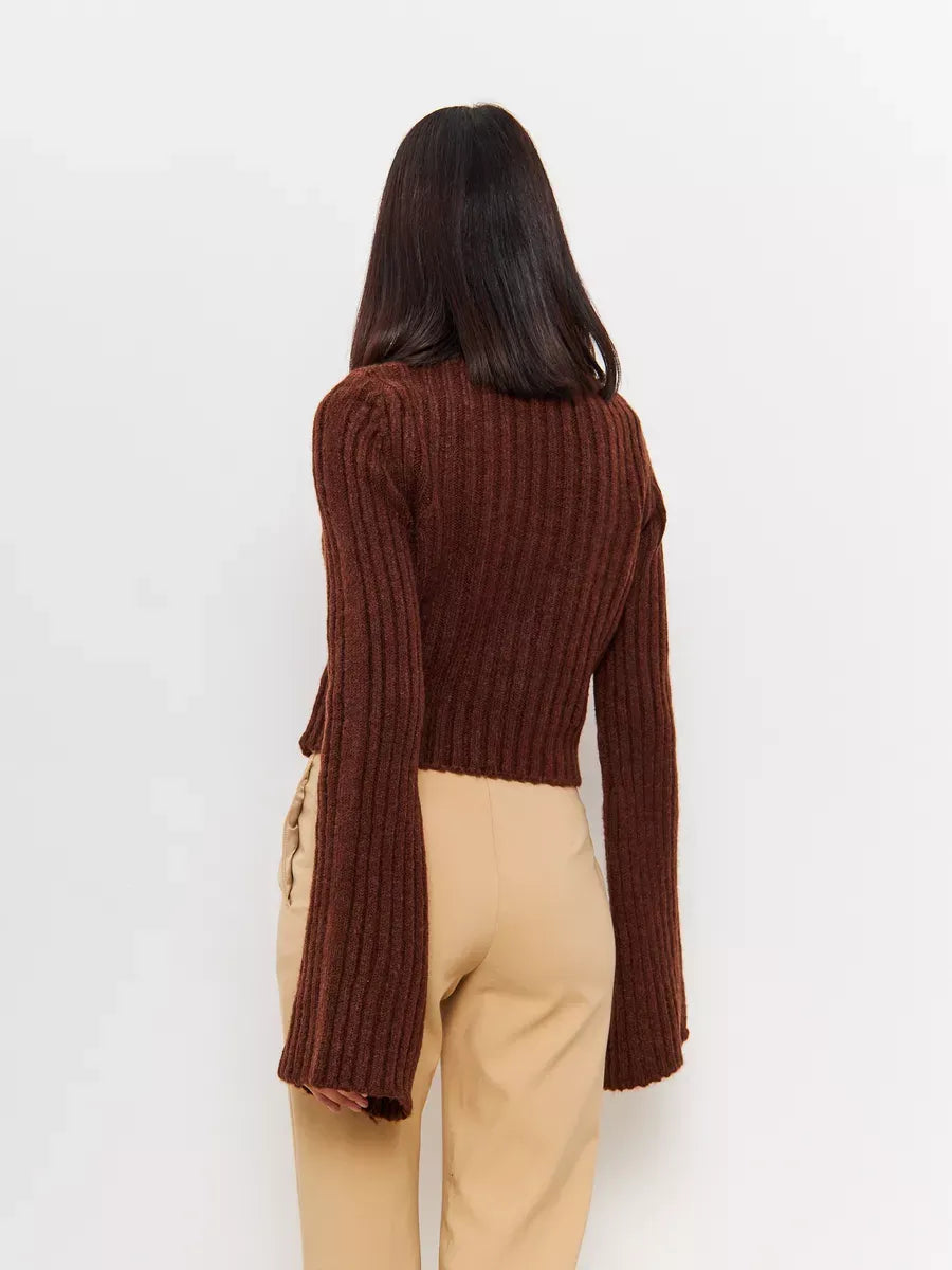 Back view of the cropped brown knit Orion Sweater by Lauven, featuring wide sleeves and ribbed texture.