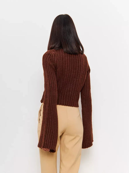 Back view of the cropped brown knit Orion Sweater by Lauven, featuring wide sleeves and ribbed texture.