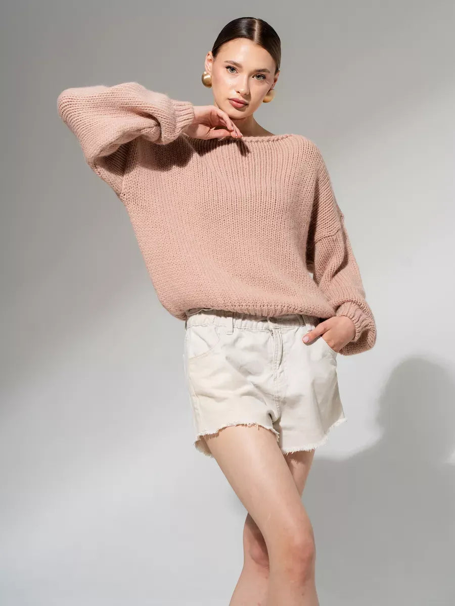 Rosea Sweater by Lauven in oversized off-shoulder knit, styled with shorts in powder pink.