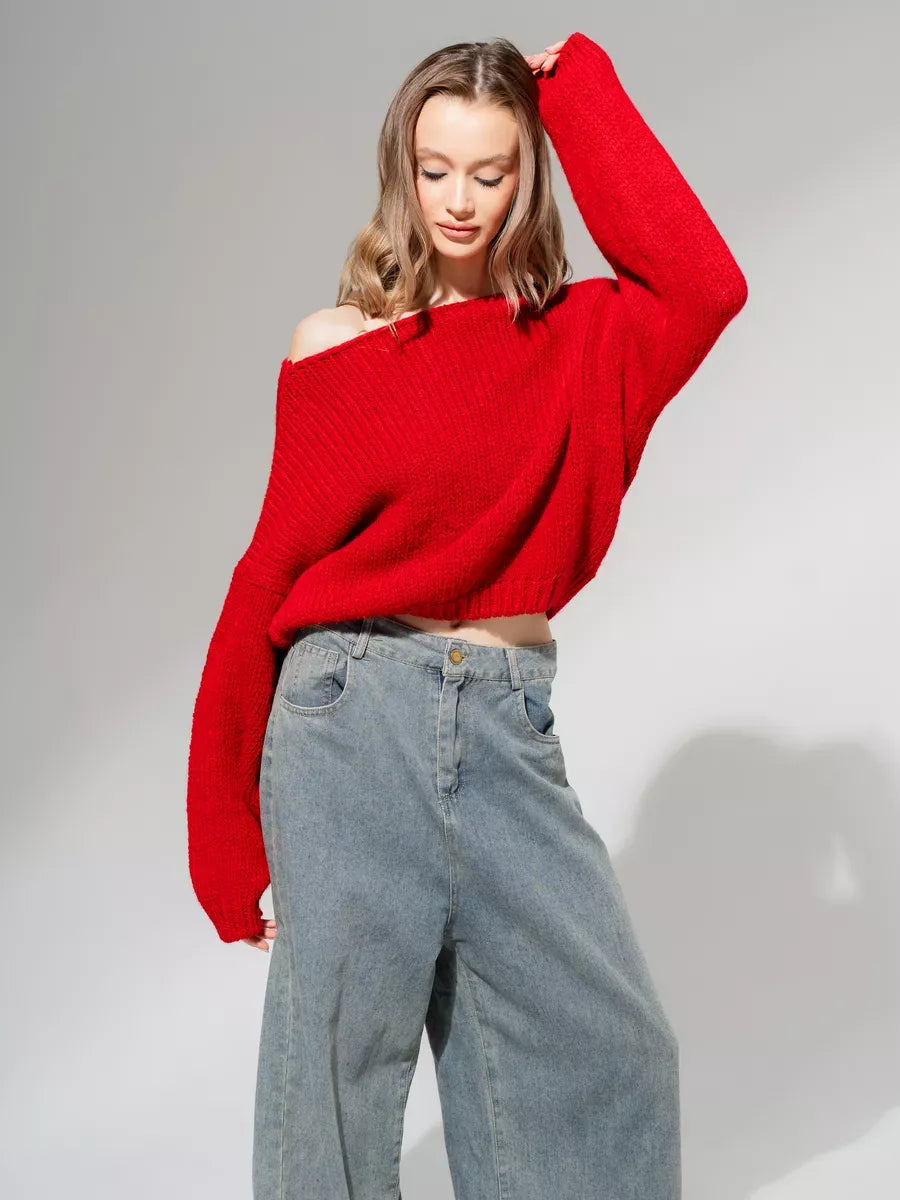 Oversized off-shoulder Scarlet Sweater in deep red by Lauven, styled with baggy jeans for a chic look.