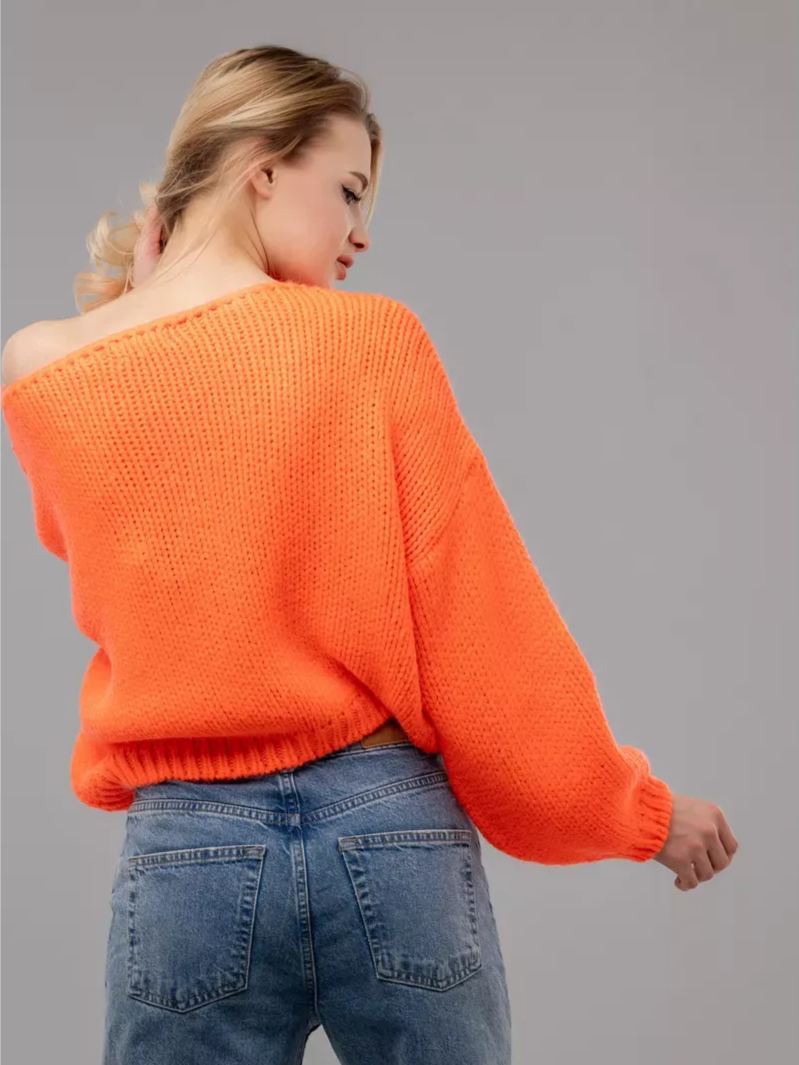 Nova Sweater by Lauven, oversized off-shoulder knit in vibrant neon orange, showcasing trendy and cozy fashion.