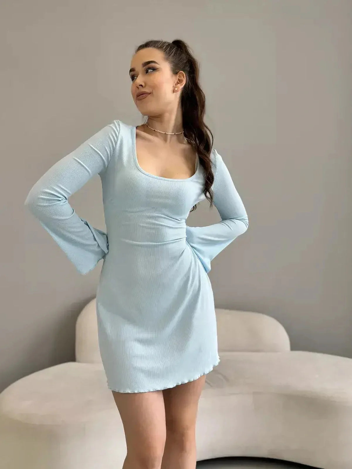 Isabella Mini Dress by Lauven in pastel blue, featuring a ribbed knit design, tie-back, and flared hem.