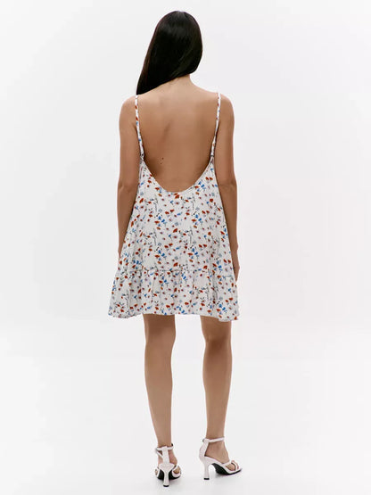 Ivory Mini Dress by Lauven, featuring an elegant open back with floral design and lightweight flared silhouette.