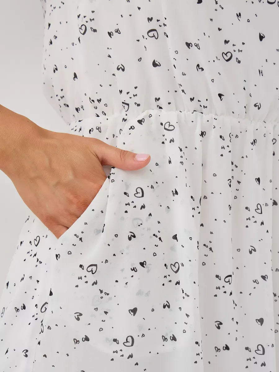 Ivory Mini Dress by Lauven featuring ruffle sleeves and a playful heart pattern with a pocket detail.