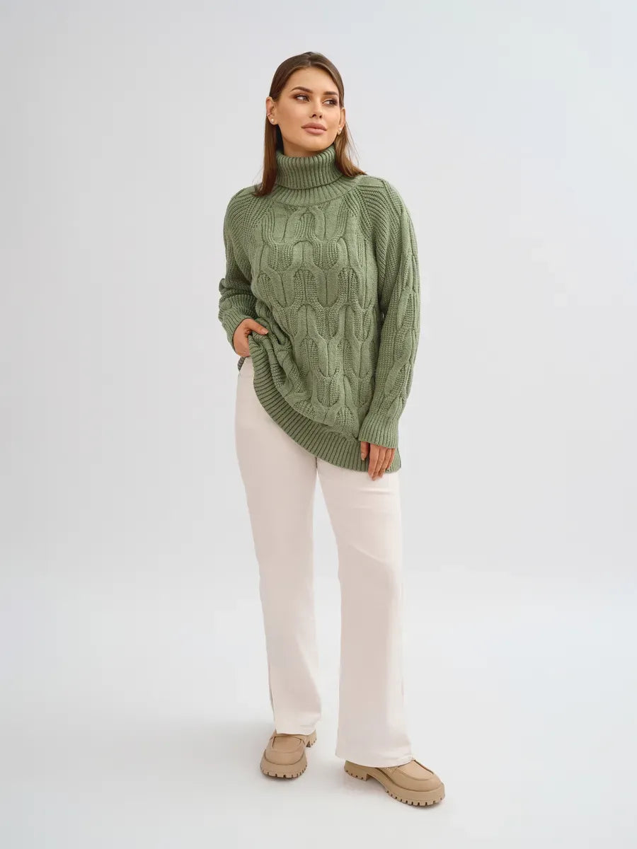 Women wearing the Ivy Sweater by Lauven, an oversized cable knit high neck piece in green color.