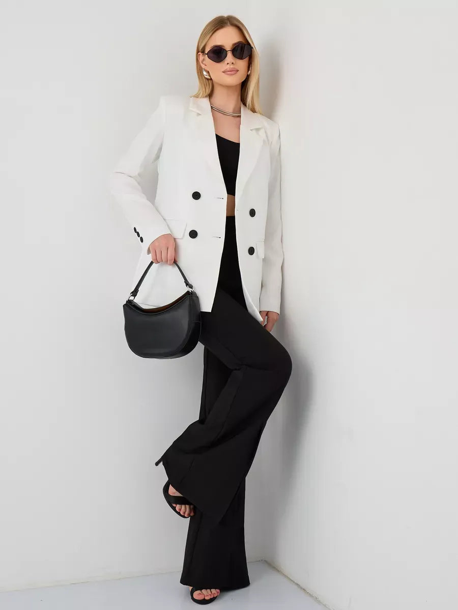 Alabaster Blazer by Lauven, oversized double-breasted white jacket styled with black pants and accessories.