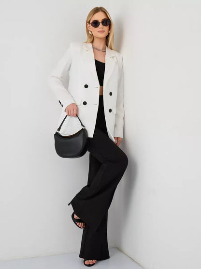Alabaster Blazer by Lauven, oversized double-breasted white jacket styled with black pants and accessories.