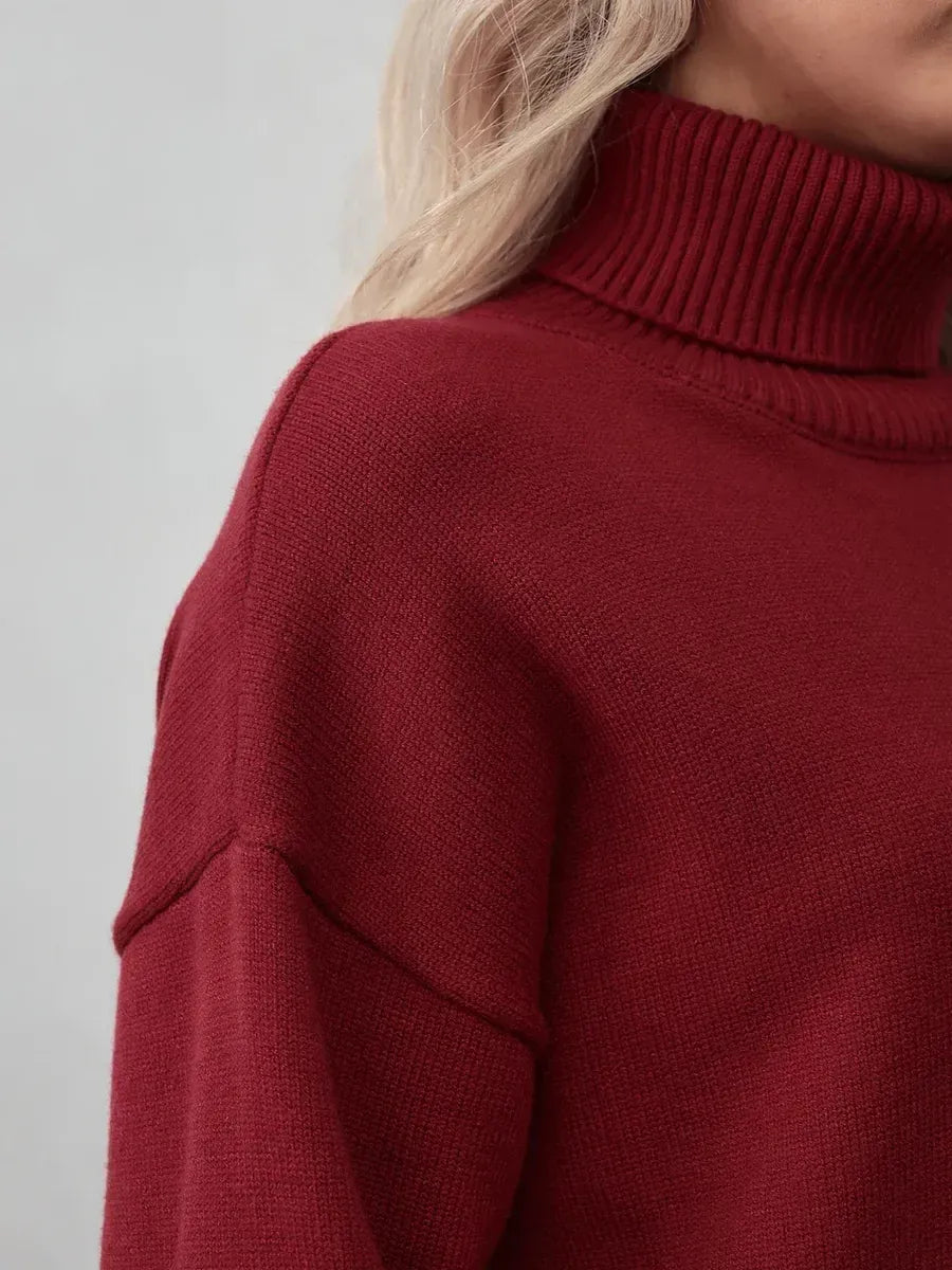Arden Sweater by Lauven, burgundy turtleneck knitwear showcasing modern elegance and cozy comfort.