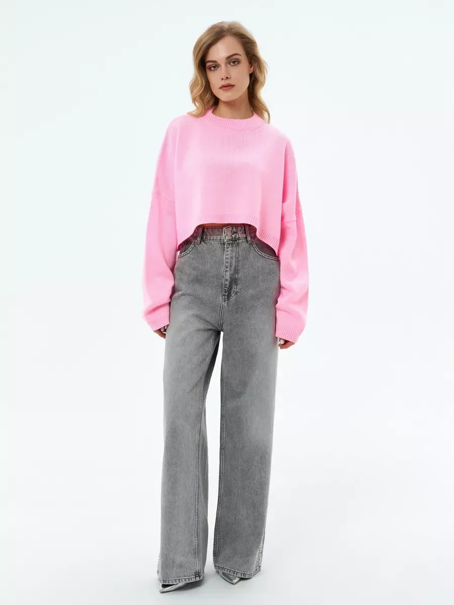 Cropped oversized knit in soft pink, the Candy Sweater by Lauven for playful, feminine style.