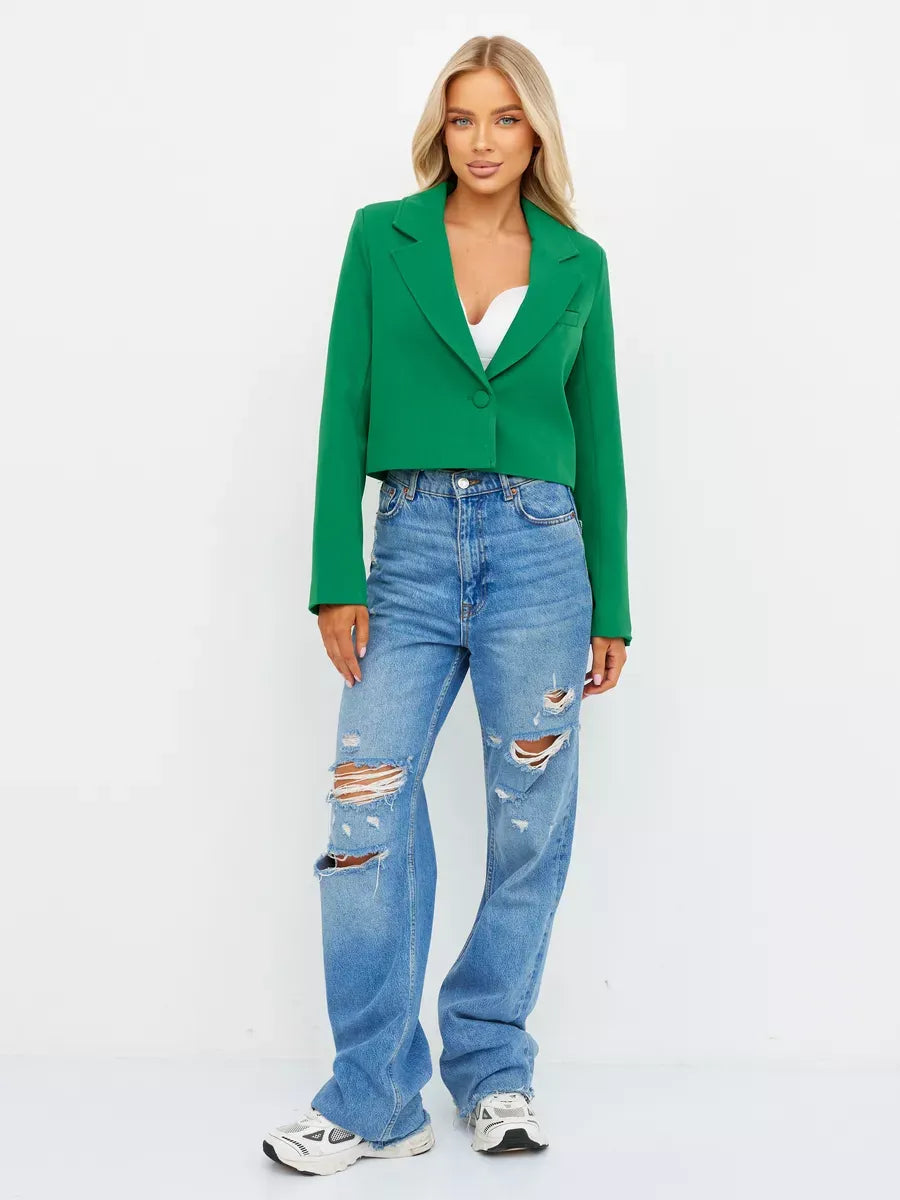Emerald Blazer by Lauven, cropped tailored elegance in vibrant green paired with blue jeans for a stylish look.