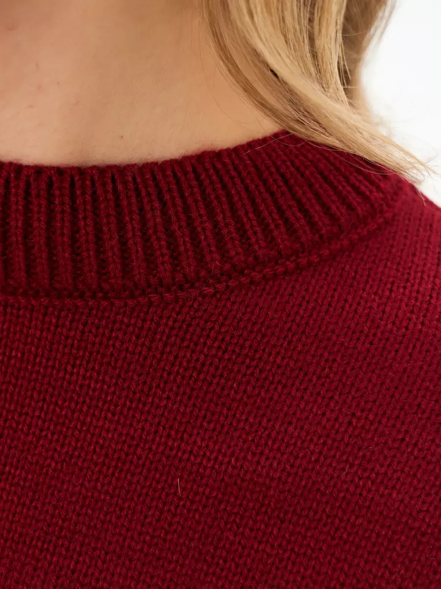Close-up of the Garnet Sweater neckline, a cropped oversized knit by Lauven in deep burgundy color.
