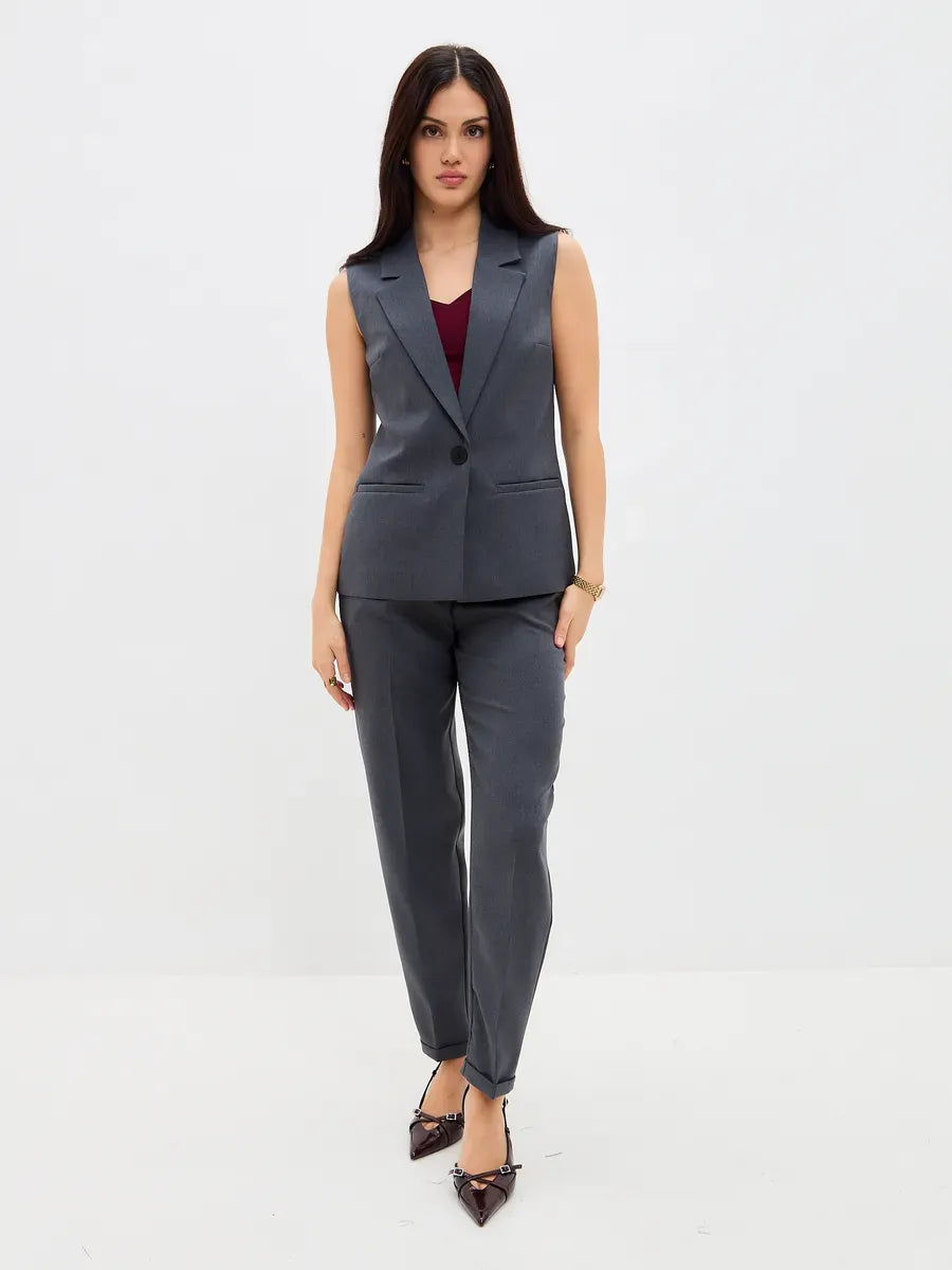 Graphite Suit Set by Lauven featuring a sleeveless vest and high-waist pants for a chic and modern look.