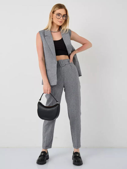 Luna Suit Set by Lauven featuring a sleeveless gray vest and high-waist pants for a chic, modern look.