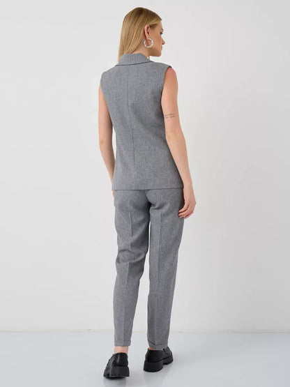 Luna Suit Set by Lauven, featuring a sleeveless gray vest and high-waist pants, perfect for a chic, modern look.