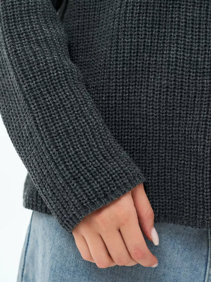 Luna Sweater by Lauven, oversized knit detail in charcoal gray, showcasing textured fabric and elegant style.