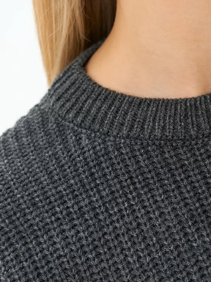 Luna Sweater by Lauven, close-up of the textured knit in charcoal gray, showcasing its oversized silhouette.