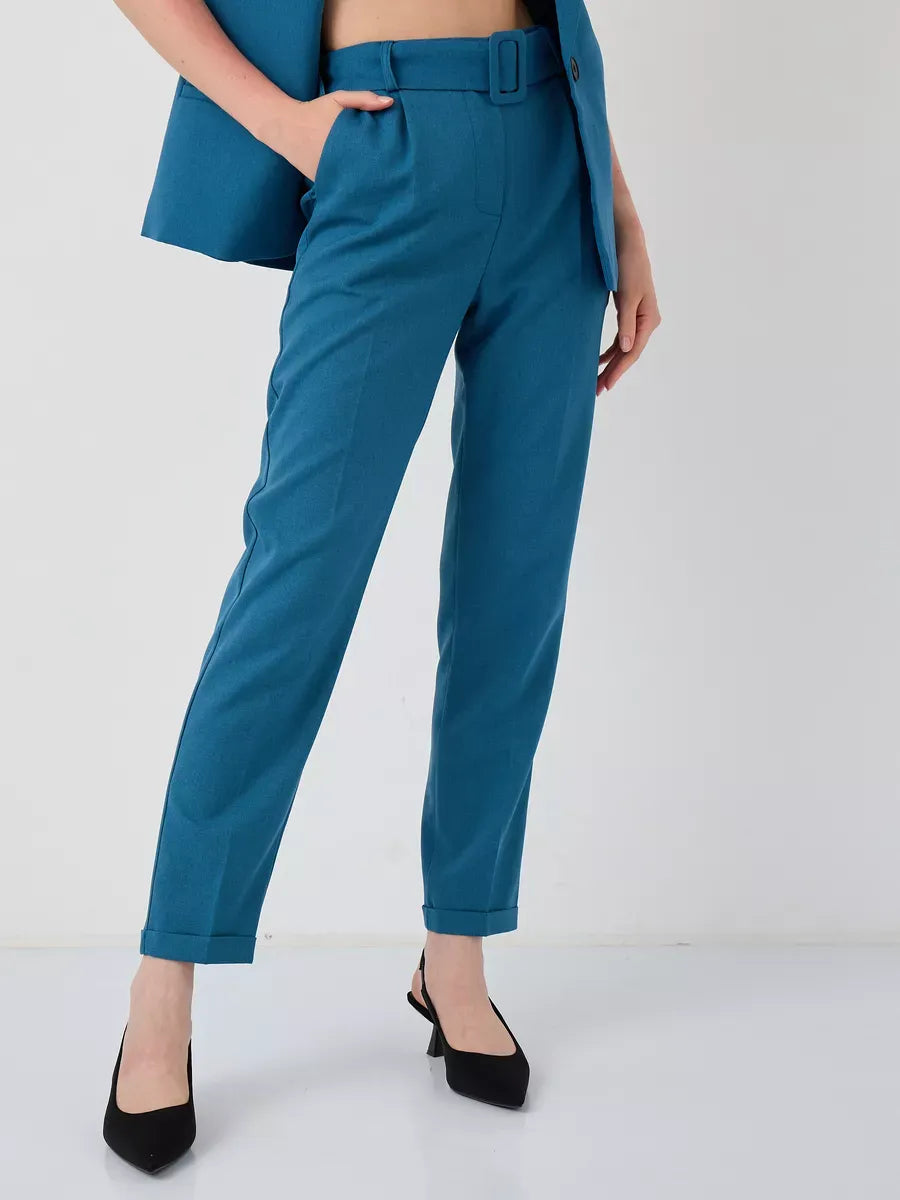 Marine Suit Set by Lauven featuring high-waist teal trousers styled with a sleeveless vest.