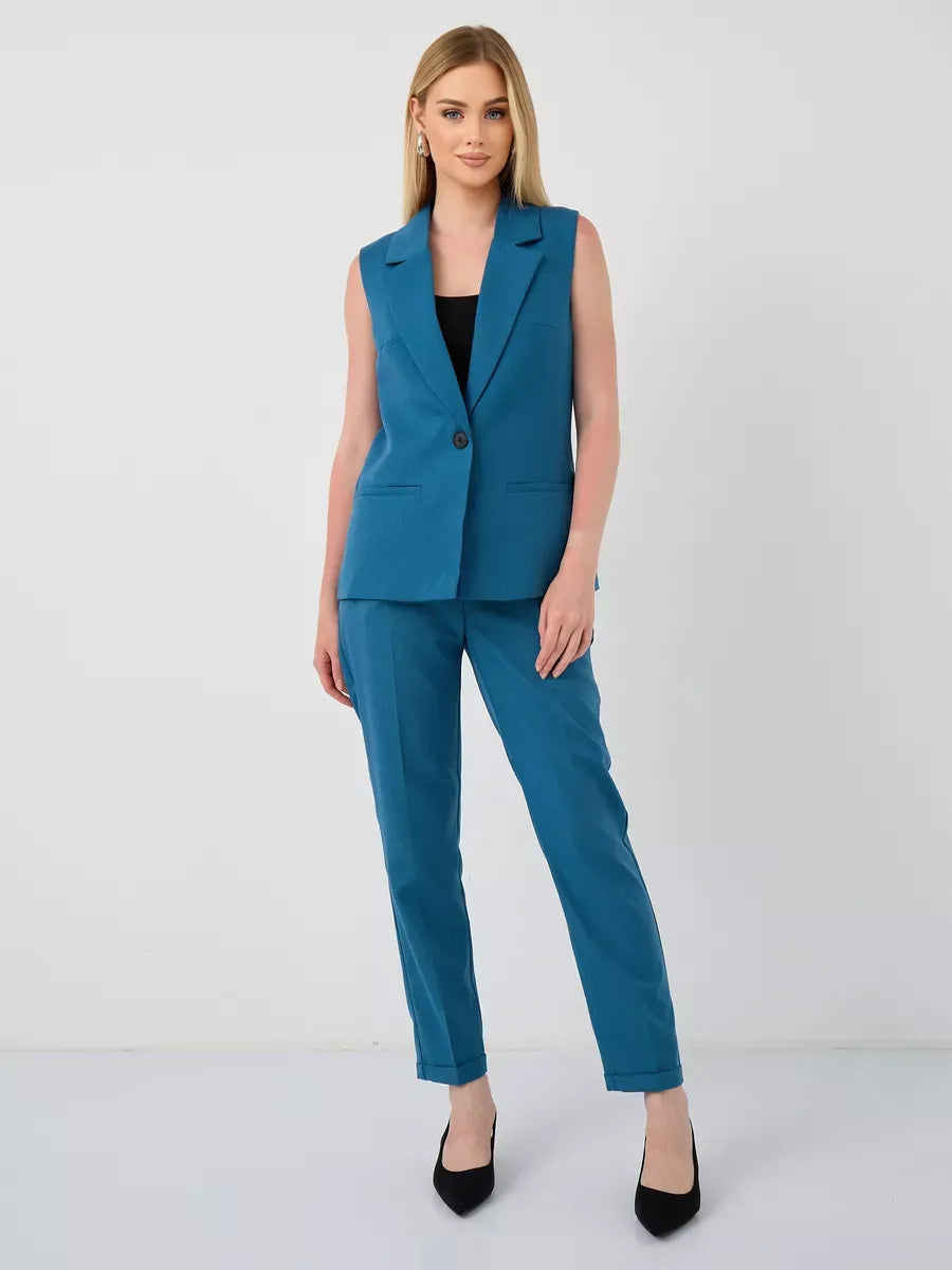 Marine Suit Set by Lauven featuring a sleeveless teal vest and high-waist pants, perfect for modern women.