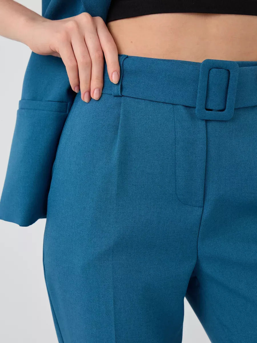 Close-up of the Marine Suit Set, featuring teal high-waist pants with a stylish belt by Lauven.