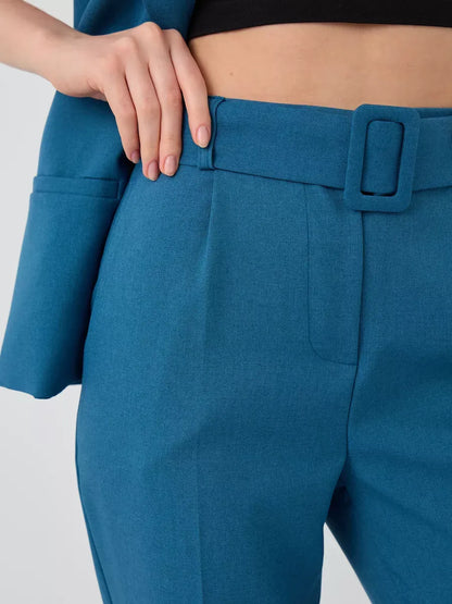 Close-up of the Marine Suit Set, featuring teal high-waist pants with a stylish belt by Lauven.
