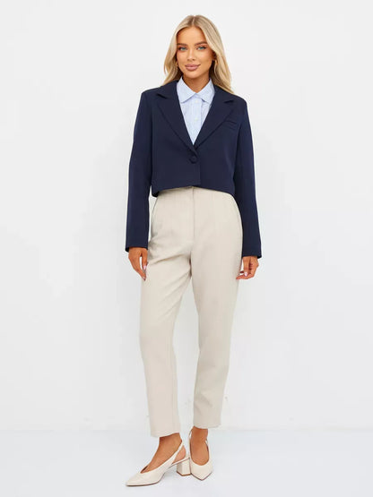 Lauven Navy Blazer in cropped tailored design paired with cream trousers, showcasing timeless style and elegance.