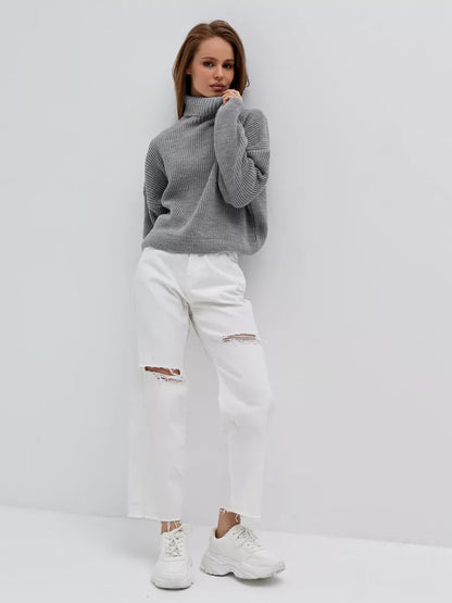 Nimbus Pullover by Lauven - Oversized light gray knit sweater with high neck worn with white ripped jeans.