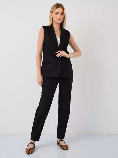 Noir Suit Set by Lauven – Sleek sleeveless black vest and high-waist pants for a modern, chic look.