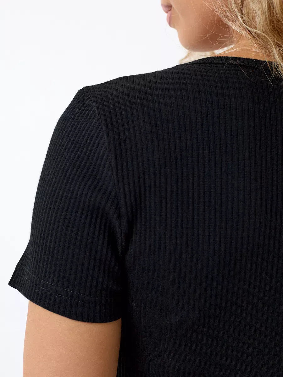 Onyx Midi Dress by Lauven showcasing the ribbed knit fabric and sleek silhouette in elegant black.