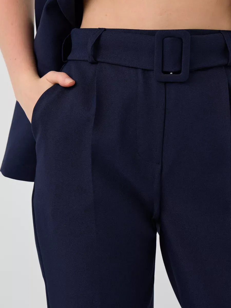 Orion Suit Set by Lauven showcasing the sleek high-waist pants with belt detail in navy.