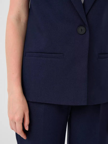 Close-up of the tailored vest from the Orion Suit Set by Lauven, showcasing its sleek navy fabric and stylish design.