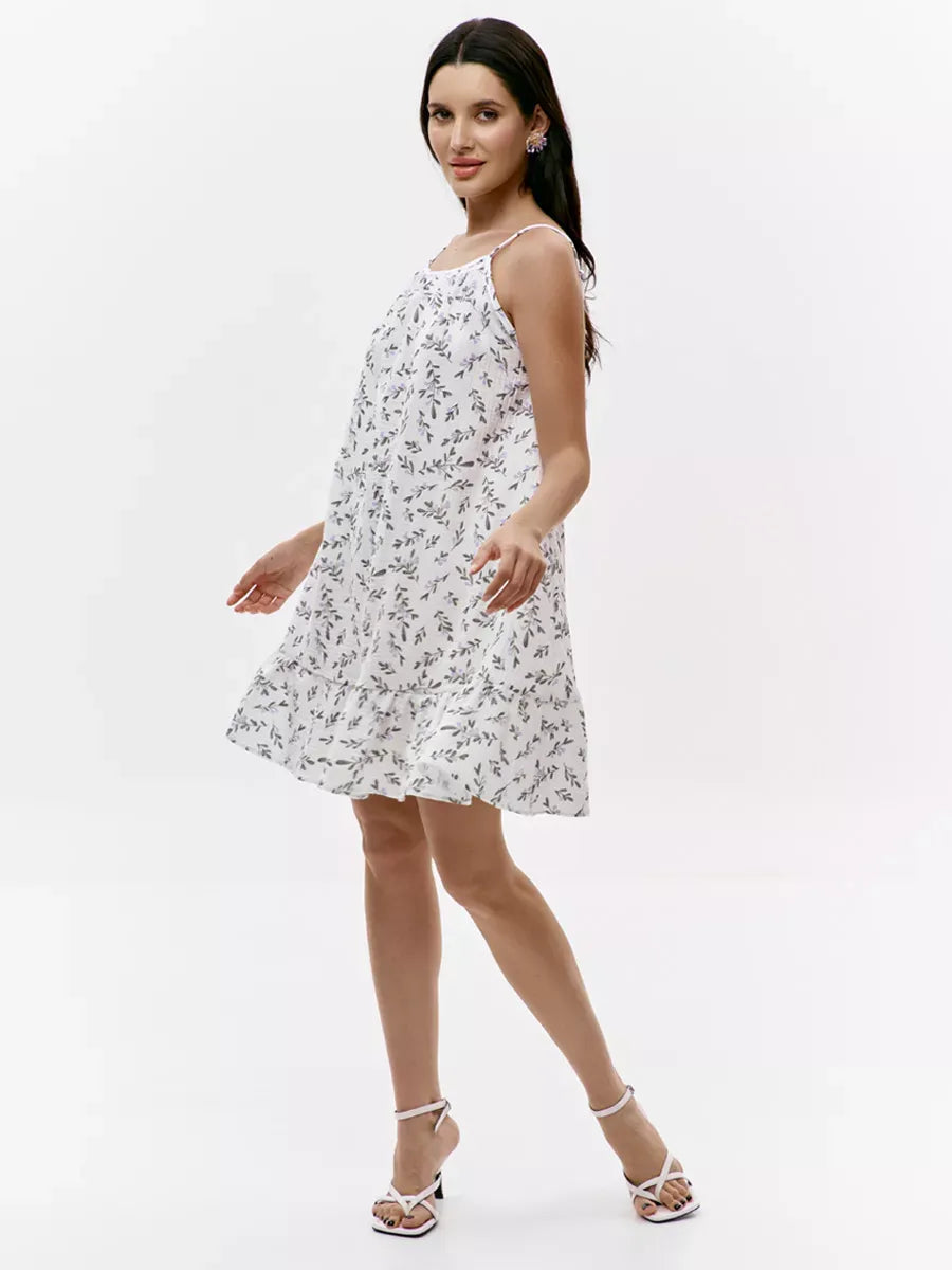 Pearl Mini Dress by Lauven, featuring a floral print and open back design, perfect for summer outings.