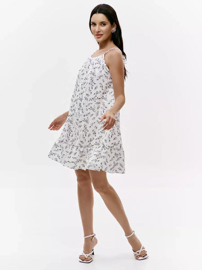 Pearl Mini Dress by Lauven, featuring a floral print and open back design, perfect for summer outings.