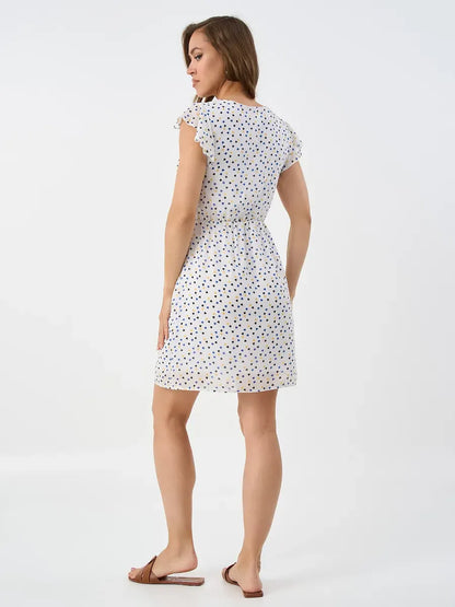 Pearl Mini Dress by Lauven, featuring a delicate ruffle sleeve design and elegant back view, perfect for warm autumn occasions.