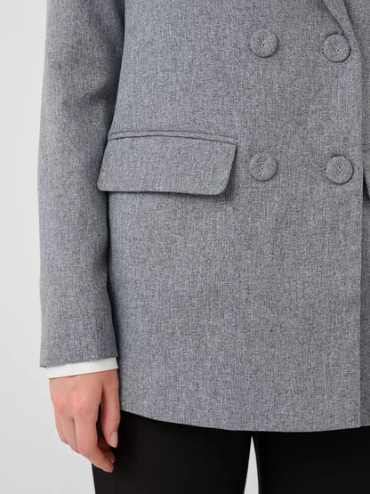 Close-up of Silverstone Blazer by Lauven, oversized double-breasted gray tailored jacket.