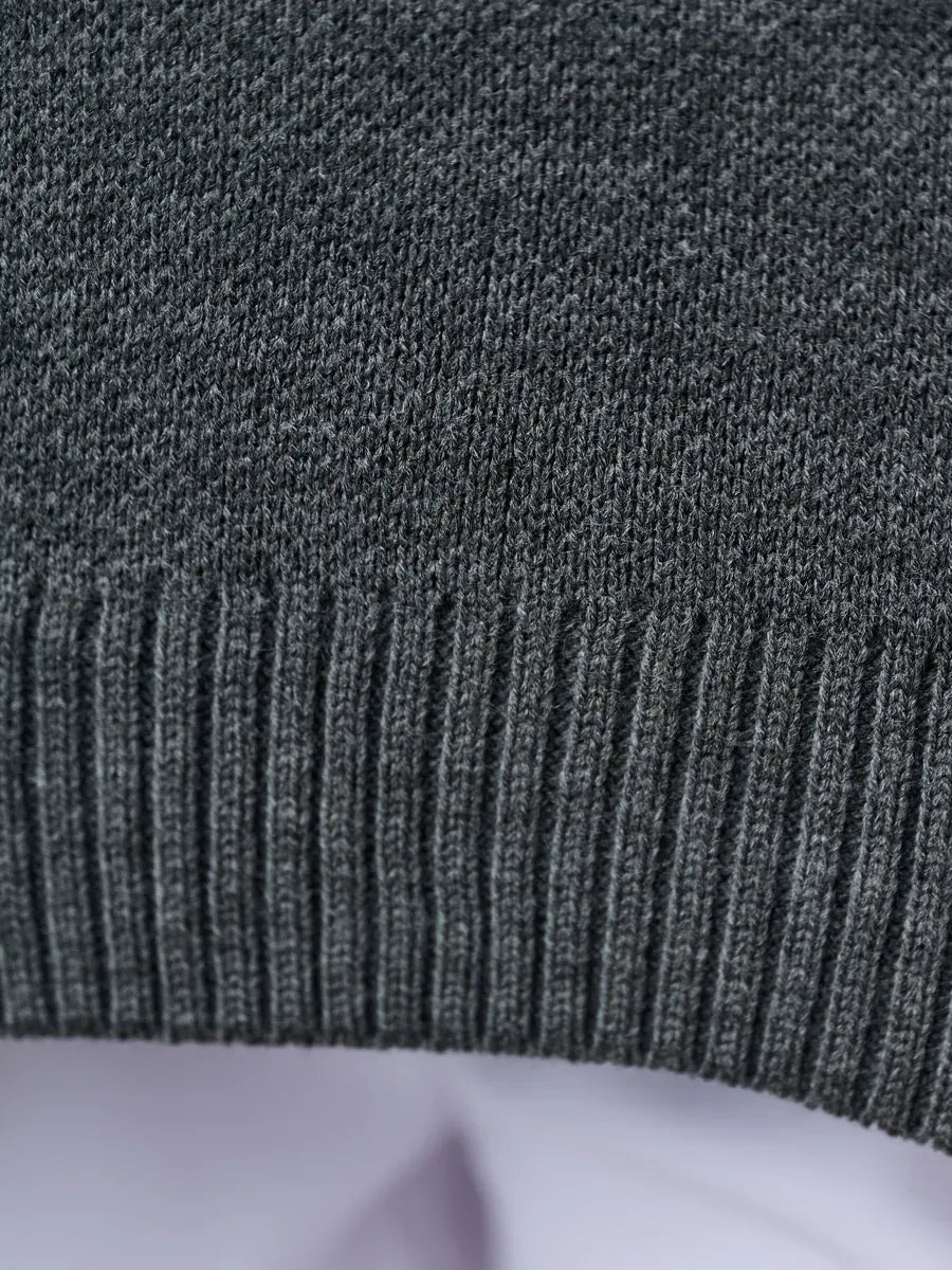 Slate Pullover by Lauven featuring a close-up of the dark gray knit texture and ribbed hem detail.