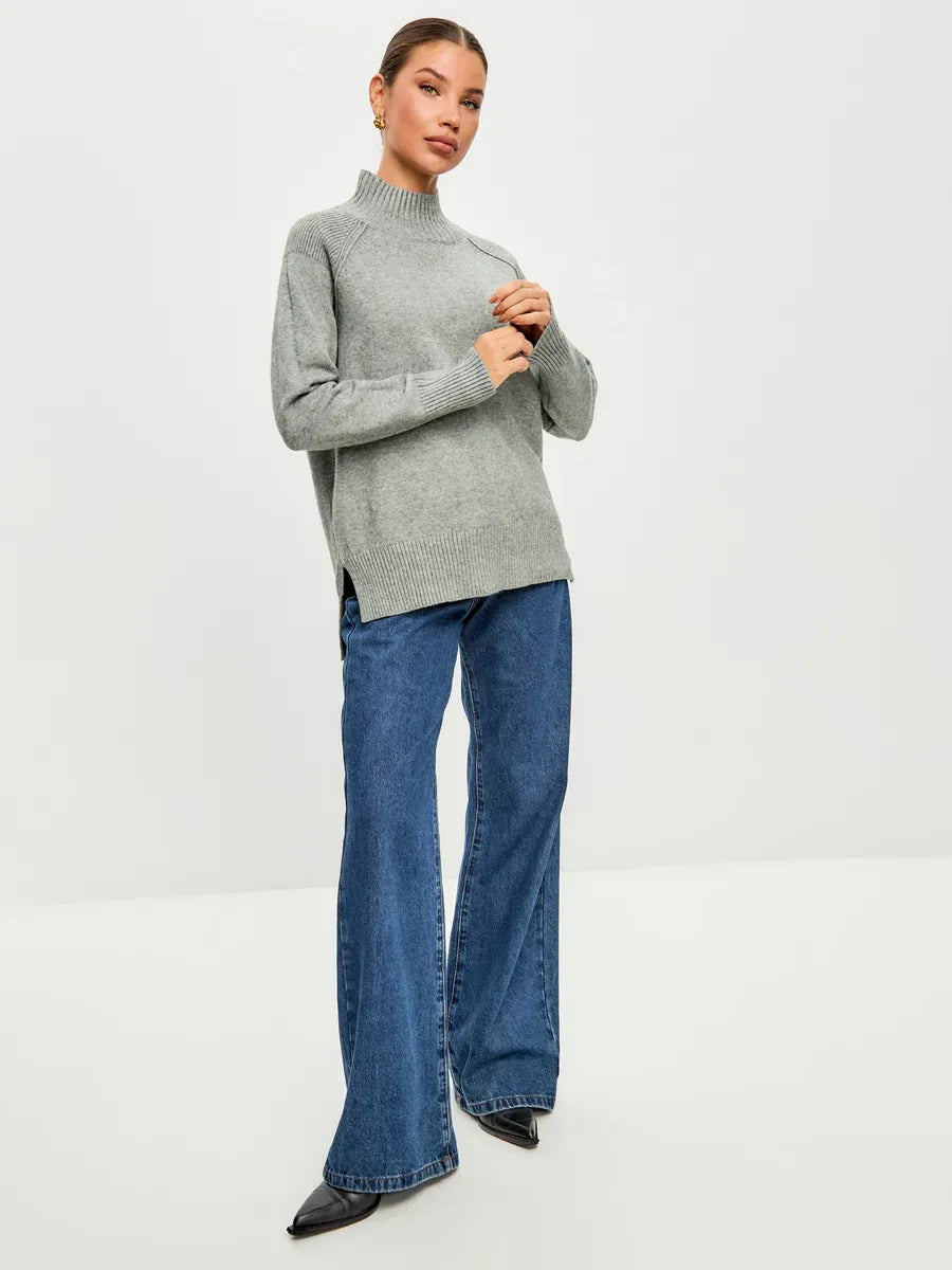 Lauven Sterling Sweater in soft grey, oversized cashmere blend, styled with flared jeans, perfect for cool seasons.