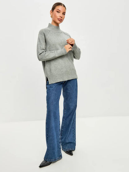 Lauven Sterling Sweater in soft grey, oversized cashmere blend, styled with flared jeans, perfect for cool seasons.