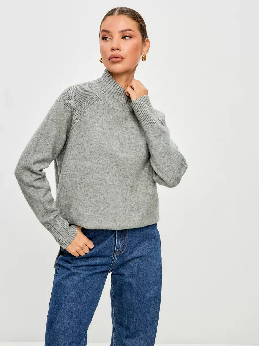 Sterling Sweater by Lauven, an oversized cashmere blend sweater in soft grey, showcasing a high ribbed neckline and relaxed fit.