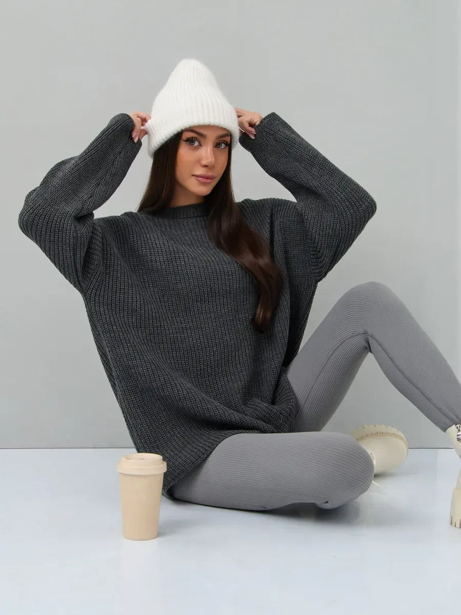Vera Sweater by Lauven - Oversized dark gray knit pullover styled with leggings and a beanie.