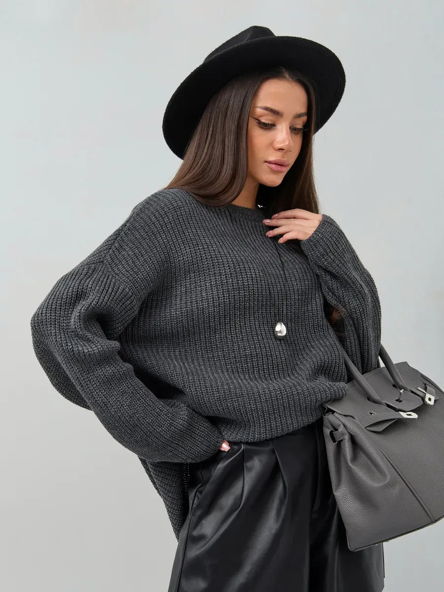 Vera Sweater by Lauven in oversized dark gray knit worn with stylish accessories.
