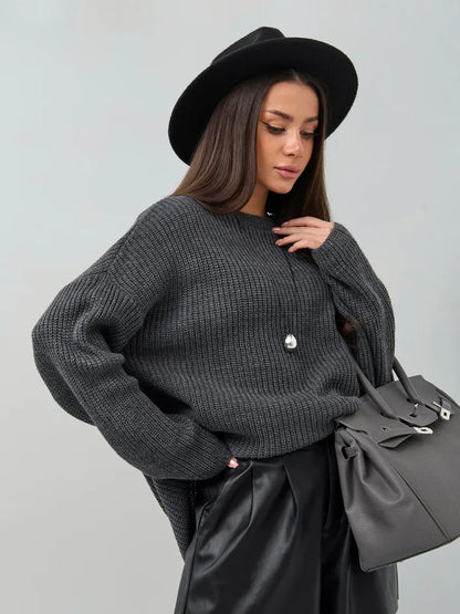 Vera Sweater by Lauven in oversized dark gray knit worn with stylish accessories.