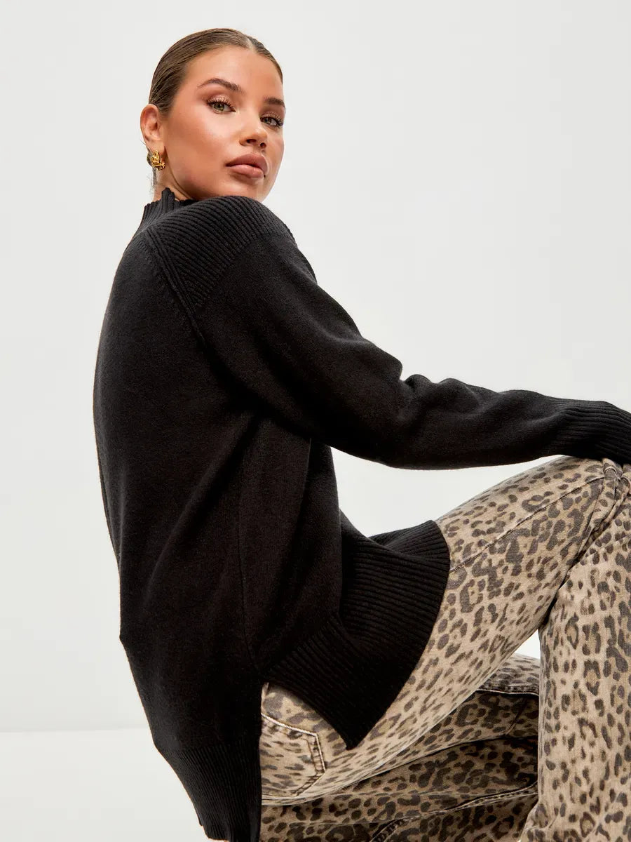Onyx Sweater by Lauven, oversized black cashmere blend with high neck, styled with leopard print pants.