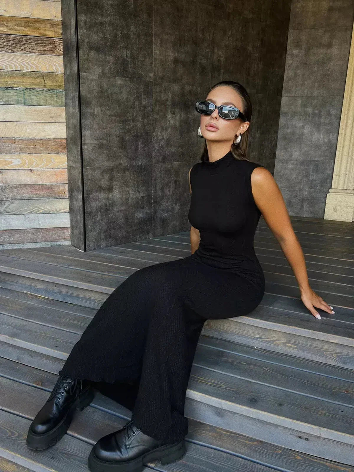 Leah Maxi Dress by Lauven, black knit bodycon gown with high mock neck, styled on a model wearing black sunglasses.