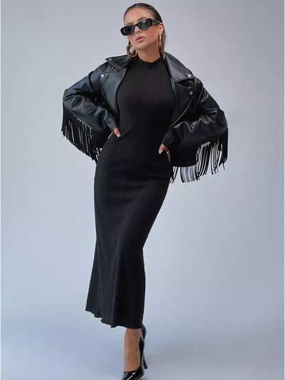 Leah Maxi Dress by Lauven, black knit bodycon gown with a high neck and floor-grazing hem, styled with a leather jacket.