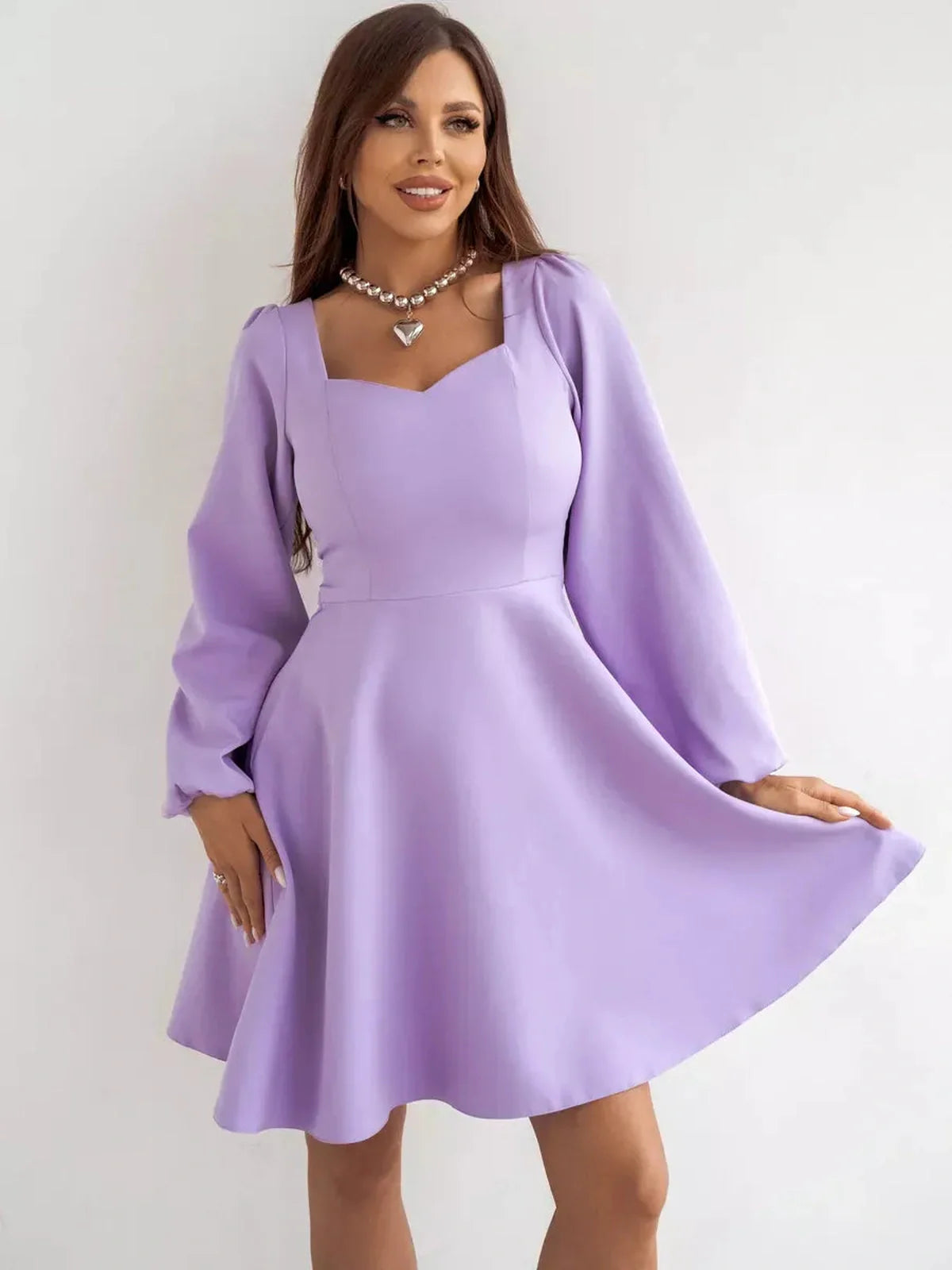 Lilac Mini Dress by Lauven featuring long sleeves, sweetheart neckline, and flared skirt in a soft lilac color.